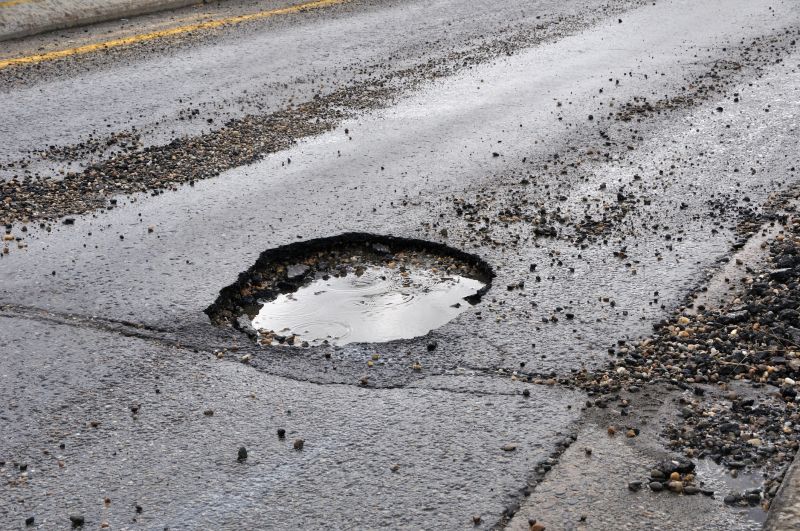How Weather Conditions Affect Asphalt Cracks And Potholes